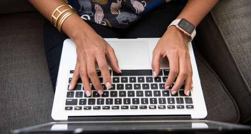 pharmacy student researching on laptop