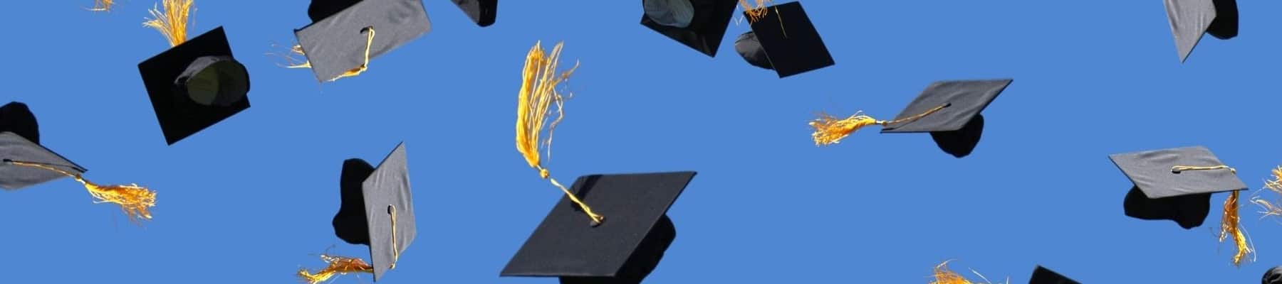 graduation hats in the air